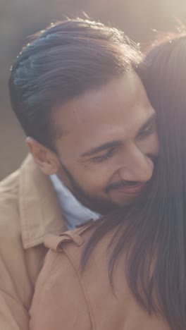 Vertical-Video-Close-Up-Of-Loving-Muslim-Couple-On-Date-Hugging-Outdoors